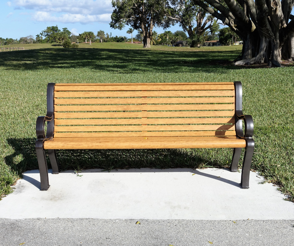 Photo of bench in a park with pad installed underneath