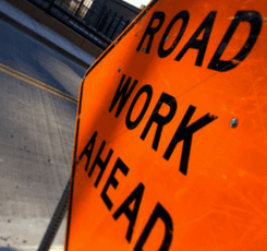 Orange "road work ahead" sign